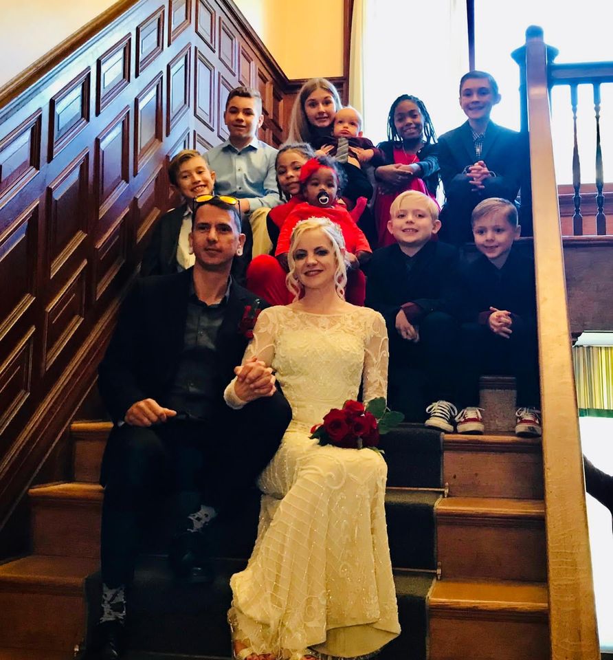 Intimate Family Wedding Photo julia and greg on stairs surrounded by children